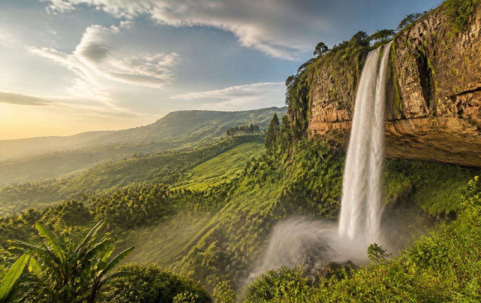 Sipi Falls plunging over a cliff into the green highlands of eastern Uganda